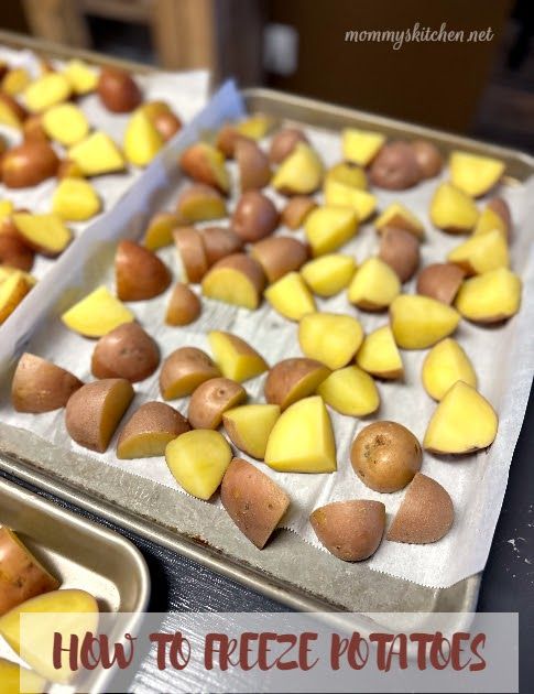 two trays filled with potatoes sitting on top of a table