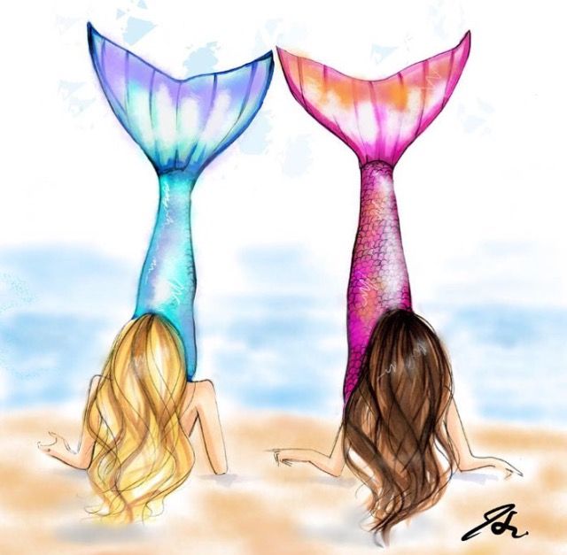 two mermaid tails sitting next to each other