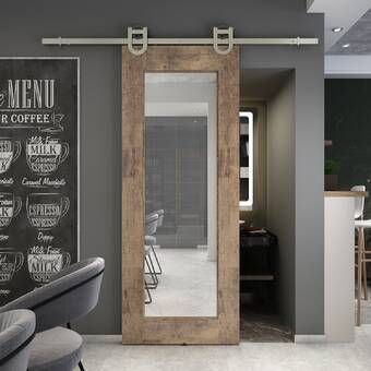 a barber shop with chairs and menus on the wall next to it's doors