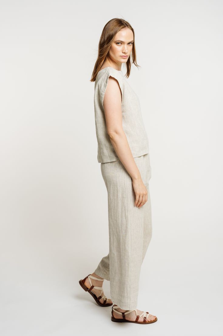 Our iconic Everyday Top is handcrafted from luxurious certified organic linen in new, Natural linen. This easy, minimalist top features a wide neckline, slightly boxy body, and mid-to-cropped length, perfect for tucking into our Everyday Crop Pant or wearing with your favorite jeans. We appreciate the natural beauty of linen's undyed color and are excited to highlight it this season in our new Natural colorway. Made with Organic Linen Lined with Organic Cotton Handmade in India Machine wash cold Versatile Cropped Linen Tops, Relaxed Linen Tops For Daywear, Everyday Versatile Linen Tops, Versatile Linen Top For Everyday, Versatile Everyday Linen Tops, Everyday Neutral Linen Top, Versatile Beige Linen Top, Relaxed Fit Linen Cropped Bottoms, Relaxed Fit Cropped Linen Bottoms