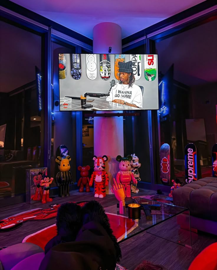 a group of stuffed animals sitting in front of a tv