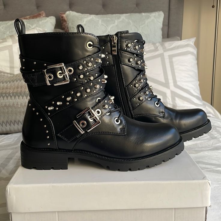 Black Triple Buckle Studded Biker Boot Unworn Trendy Spring Moto Boots With Buckle Closure, Trendy Moto Boots With Buckle Closure For Spring, Edgy Moto Boots With Buckle Closure For Party, Spring Punk Style Ankle Moto Boots, Punk Style Ankle Moto Boots For Spring, Edgy Ankle Moto Boots For Spring, Punk Moto Boots With Buckle Closure For Party, Punk Moto Boots With Buckle Closure For Fall, Punk Moto Boots With Buckle For Fall