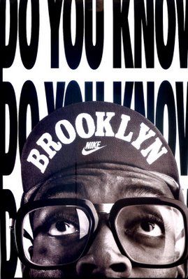 a man wearing glasses and a hat with the words brooklyn printed on it's forehead