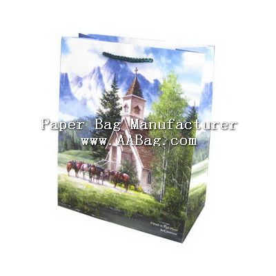 a paper bag with an image of horses in front of a church on the hill