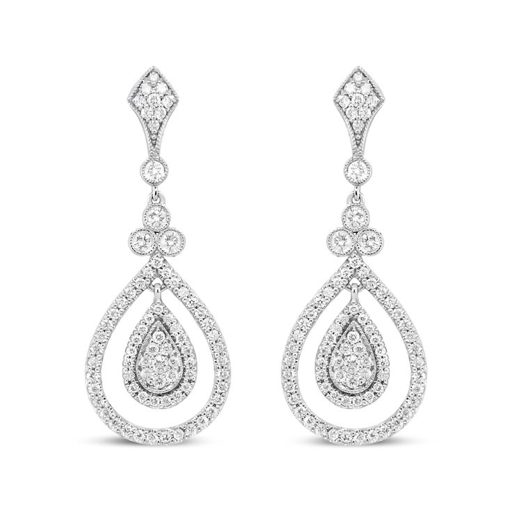 Let the sparkle of diamonds enhance your every look! Glimmering prong-set round diamonds adorn polished 18k white gold, giving you a stunning look of sophistication. These diamonds total 1 1/4 cttw with an approximate F-G Color and VS1-VS2 Clarity. The silhouette features an intricate upper dangle set with diamonds clusters above a single round diamond encases in a secure bezel setting with milgrain detail. Beginning the lower dangle is a trio of round white diamonds that signify the past, present, and future, which are also showcases in bezel settings with milgrain ornamentation. A cluster of round, prong-set diamonds form a teardrop silhouette haloed by additional round, prong-set diamonds. A metal framework prong-set with round diamonds adds a second halo to this centerpiece that captur Diamond Chandelier Earrings With Brilliant Cut For Anniversary, Anniversary Diamond Chandelier Earrings With Brilliant Cut, Diamond White Diamond Chandelier Earrings, Classic Brilliant Cut Chandelier Earrings For Anniversary, Diamond White Chandelier Earrings With Diamond Cut, Diamond White Chandelier Earrings In Fine Jewelry Style, Classic White Gold Diamond Chandelier Earrings, Dazzling Diamond Teardrop Chandelier Earrings, Classic Brilliant Cut Chandelier Earrings For Formal Occasions