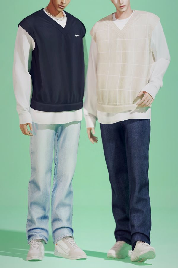 two young men standing next to each other in front of a green background, both wearing sweaters and jeans