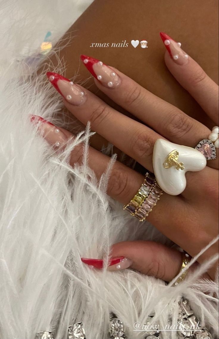 Christmas Aesthetic Nails Ideas, Dark Red Vampy Nails, Xmas Nails Aesthetic, Red French Tip With Pearls, Red Jewel Nails, Valentines Day Nails 2024, Holiday Nails Long, Cute Valentine’s Day Nails, Christmas Acrylic Nails Holiday