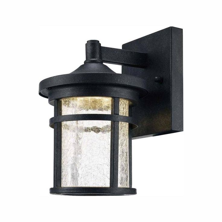 an outdoor wall light that is black and has frosted glass on the front side