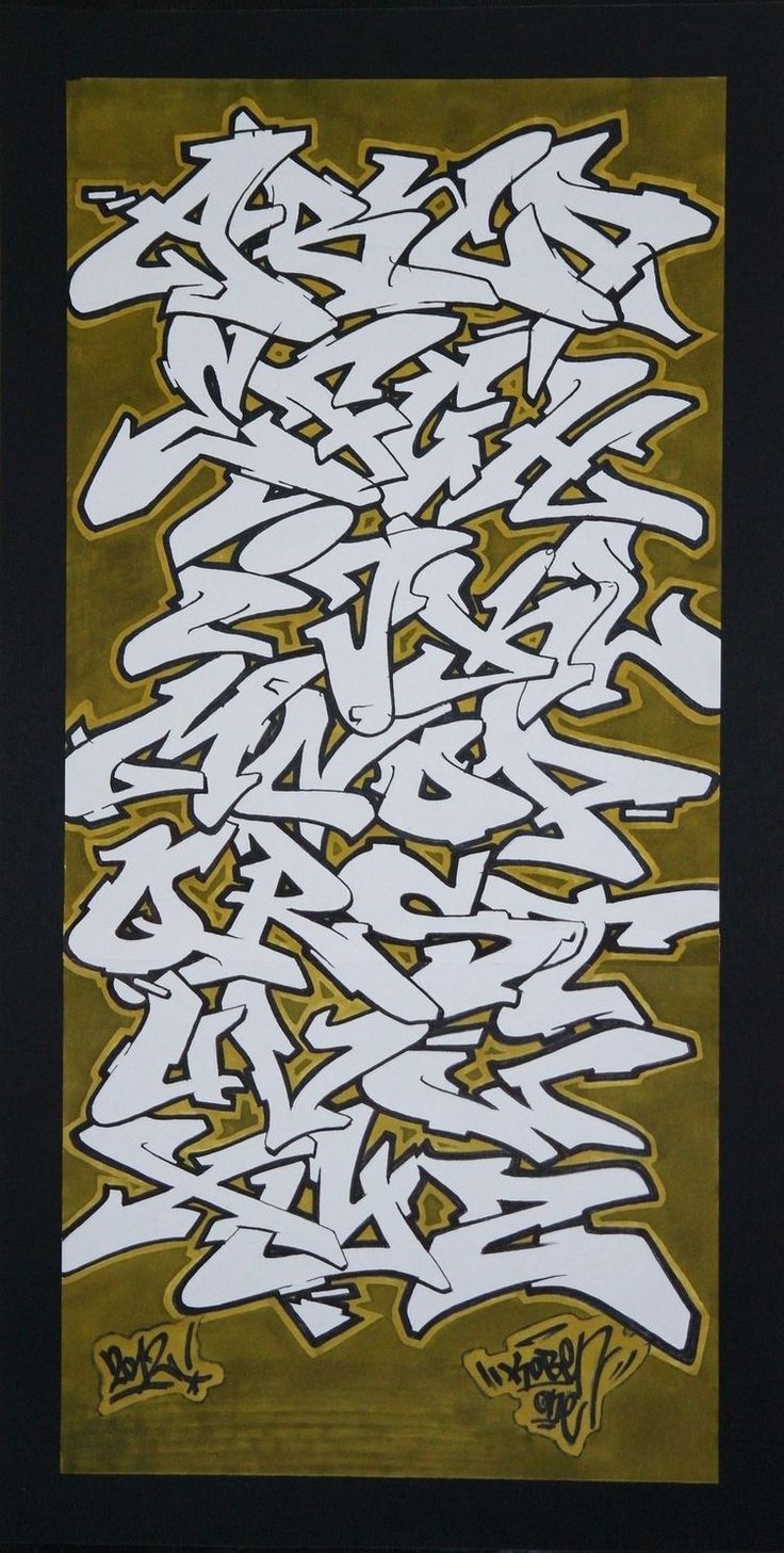 an image of graffiti written in white and yellow on a brown background with black frame