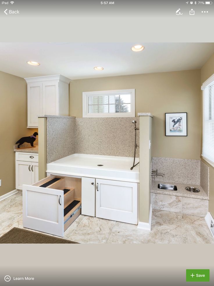 an image of a kitchen being remodeled with white cabinets and drawers in the center area