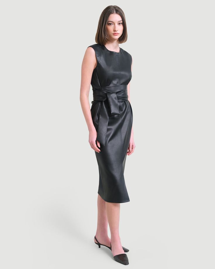 A sleek and modernized take on the LBD — this vegan leather dress is perfect for the office layered over a long-sleeve tee or on its own for date night. See below for our general Size Guide and available measurements Made of polyester, lining made of polyester Machine wash cold separately, tumble dry at low temperature, cool iron as needed Modern Evening Midi Dress For Fall, Leather Midi Dress For Work, Black Leather Office Dress, Black Leather Dresses For Office, Sleek Leather Workwear Dress, Sleek Leather Dresses For Workwear, Sleek Leather Dress For Work, Sleek Office Dresses For Fall, Chic Leather Workwear Dress