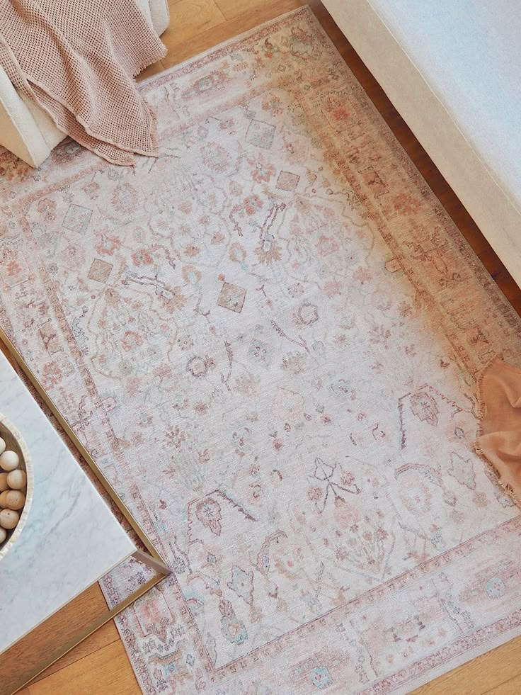 a rug on the floor next to a bowl of beans