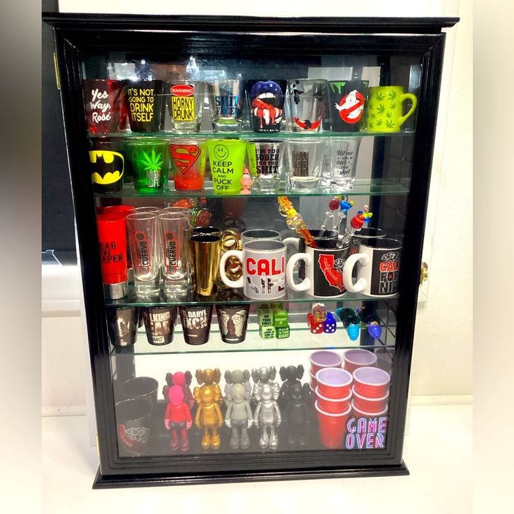 a display case filled with lots of different types of cups and glasses on top of each other