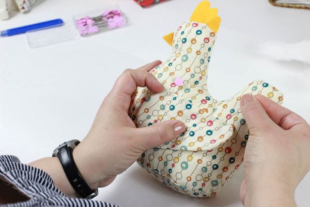 someone is making a paper chicken out of fabric