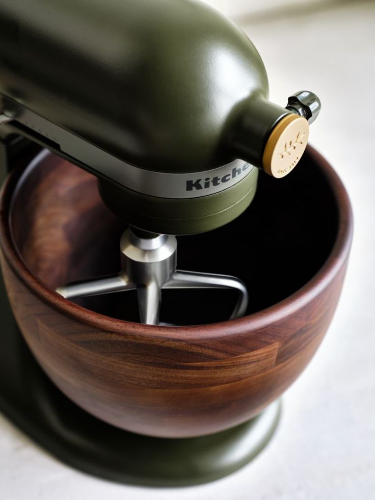 a kitchen aid mixer in a wooden bowl