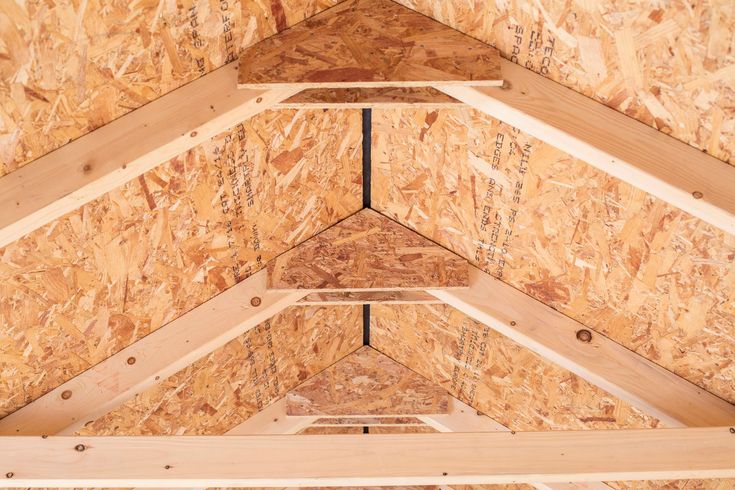 the inside of a building with wood framing