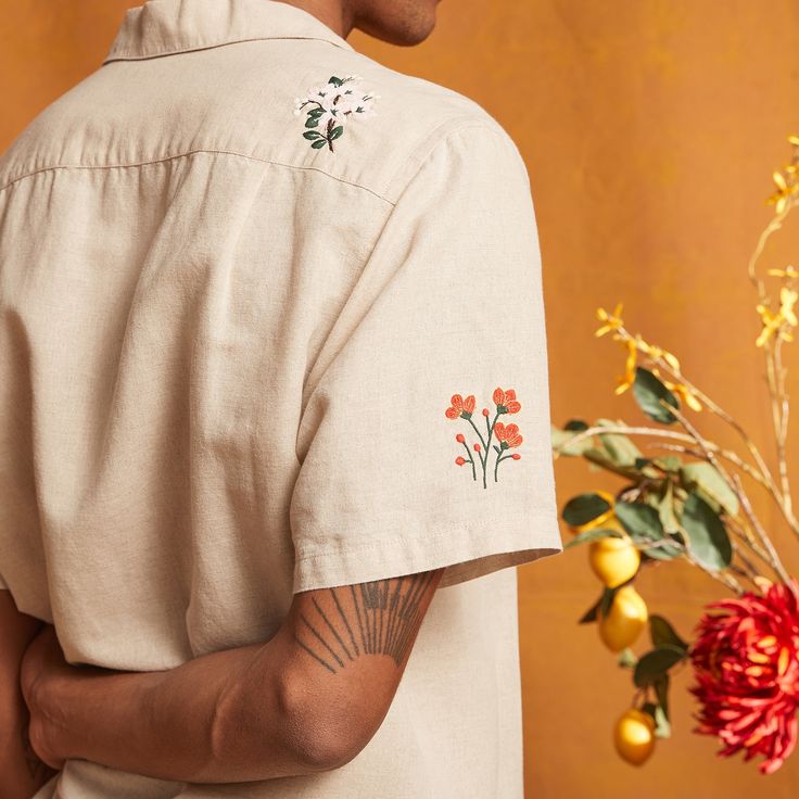 Offering traditional craftsmanship tempered with current trends, Portuguese Flannel crafts its Spring 2 shirt from a linen and cotton blend. Its beige colourway lends itself to all of your casual earthy tones while embroidered floral motifs add subtle detail. Style yours with loose-cut shorts. Embroidered Clothes Men, Cotton Camp Shirt With Floral Embroidery, Embroidered Mens Shirt, Men Shirt Embroidery, Shirt Embroidery Ideas For Men, Embroidered Cotton Shirt For Streetwear, Retro Embroidered Cotton Shirt, Flannel Crafts, Casual Embroidered Button-up Camp Shirt