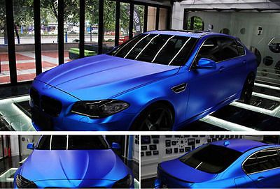 three different shots of a blue car in the process of being put on display at an automobile showroom