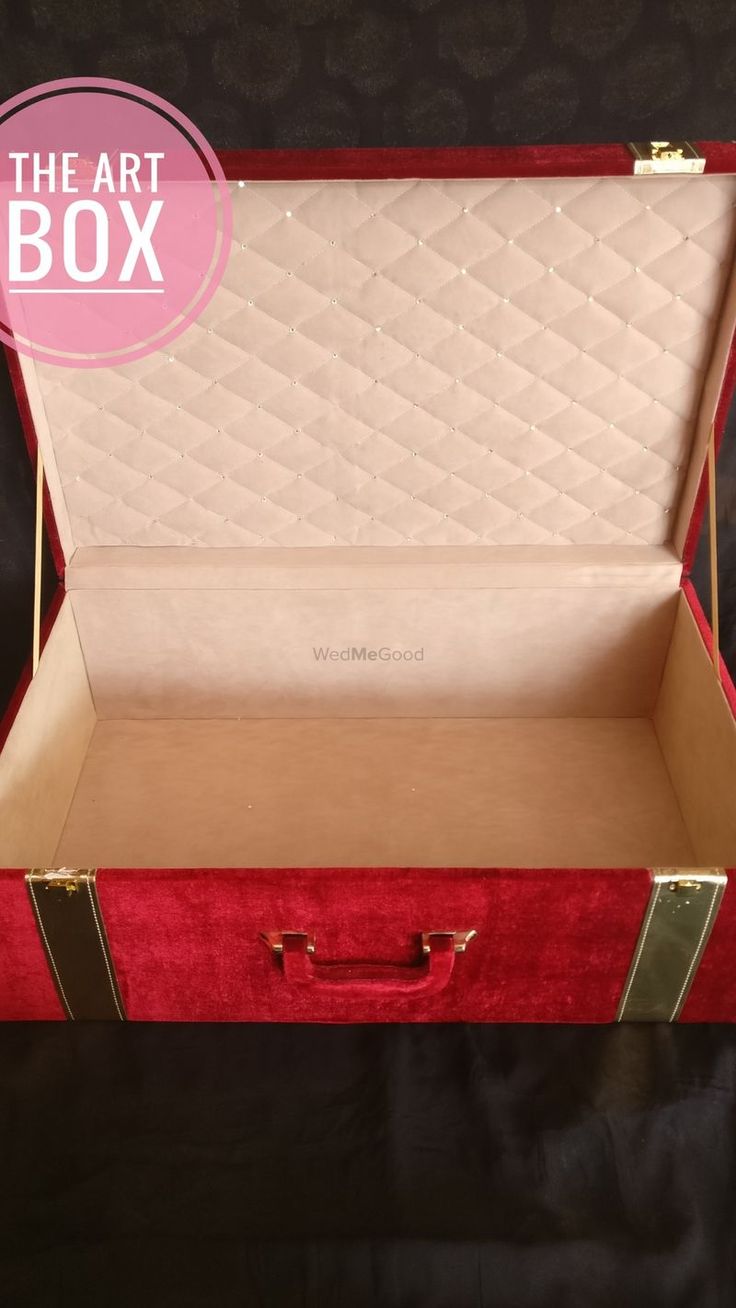 an open red velvet box with the lid closed