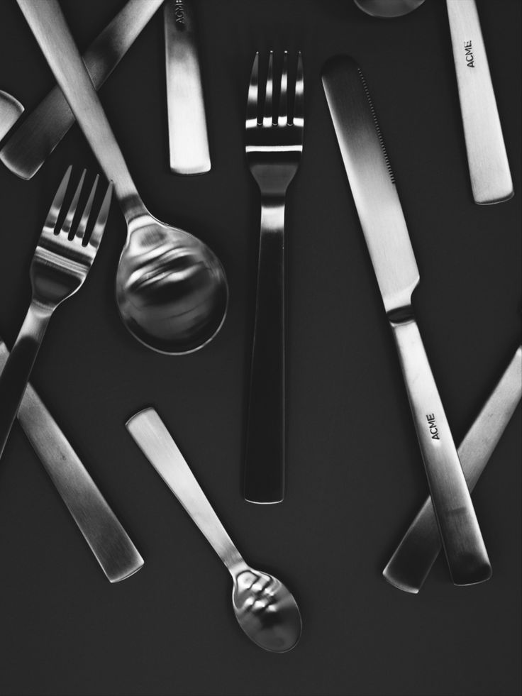 black and white photograph of utensils and spoons