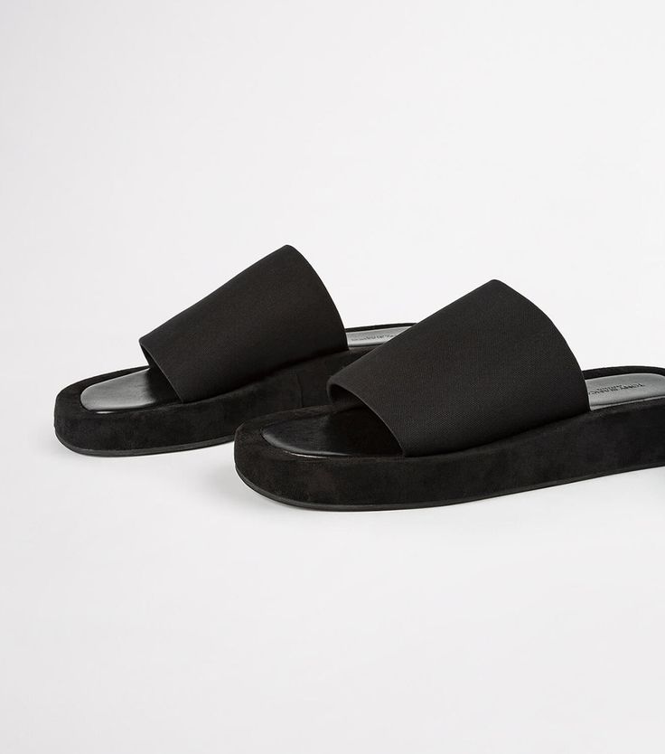 We're know you love effortless style. Cue our Isabel slides in classic black. Featuring an elevated platform foot bed, with simple fabric strap design, they're the perfect Summer sandal for the minimalist. - Material: Fabric upper and rubber lining - Toe-shape: Round toe shape - Pattern: Fabric strap - Fit: Runs true to size - Heel Height: 1.5cm Black Synthetic Slides With Round Toe, Black Synthetic Slide Sandals, Black Slip-on Open Toe Slides, Black Slip-resistant Slides For The Beach, Black Slip-resistant Beach Slides, Thigh High Boots Flat, Simple Fabric, Embellished Heels, Tony Bianco