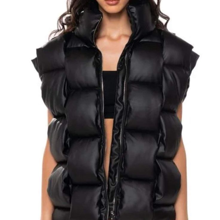 Black Woven Puffer Vest Winter Streetwear Vest With Zipper Closure, Black Vest With Padded Collar For Streetwear, Black Vest With Padded Collar For Fall, Edgy Solid Color Winter Outerwear, Edgy Black Vest For Fall, Black Padded Collar Winter Vest, Black Winter Vest With Padded Collar, Black Casual Vest With Zipper Closure, Casual Black Vest With Zipper Closure