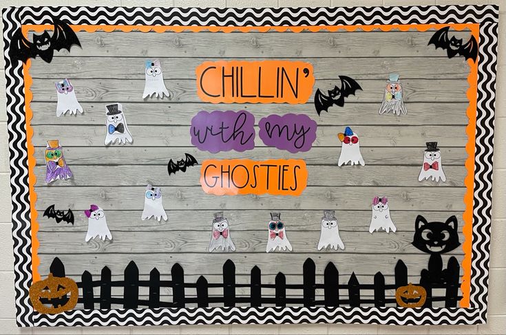 a bulletin board with halloween decorations and ghostes on it that says chillin'wh my ghosts