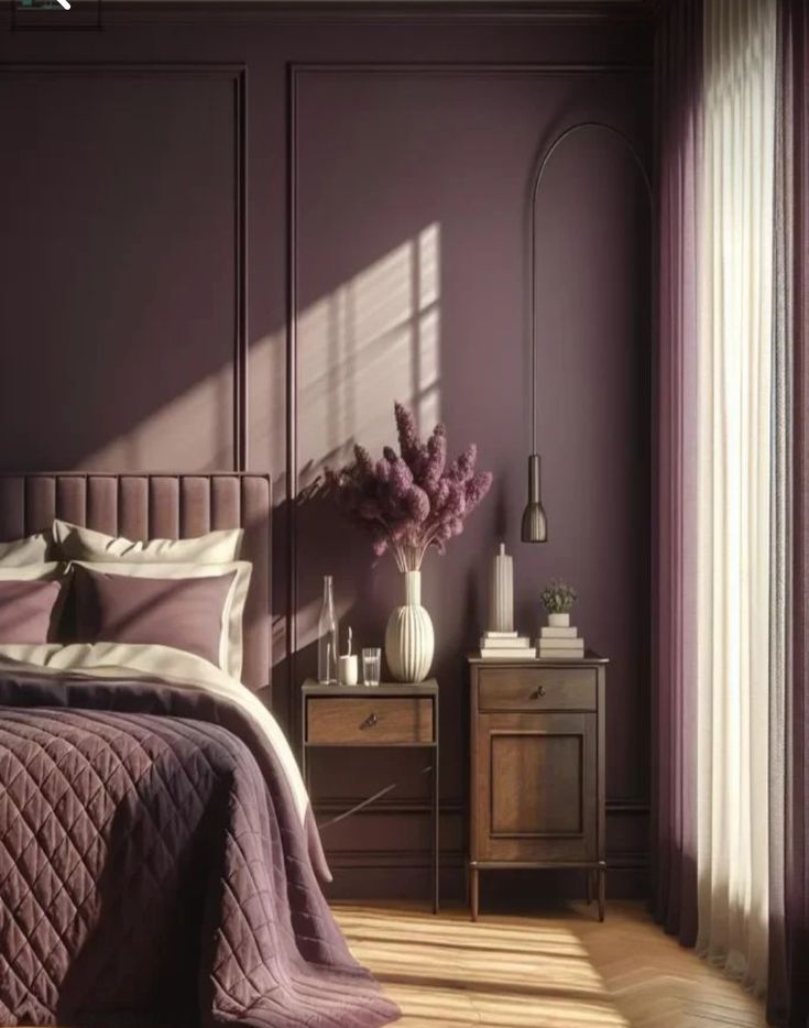 a bedroom with purple walls and wooden flooring is pictured in this image, there are two nightstands on either side of the bed