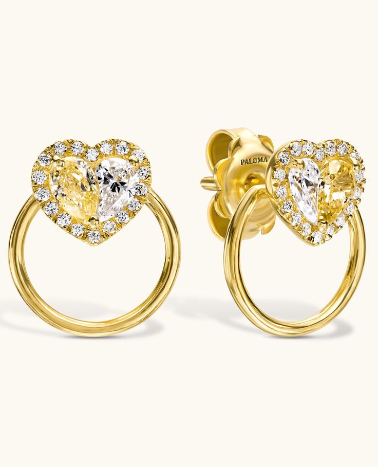 Introducing Paloma's iconic Heart, this distinctive earring design showcases a pair of exquisite fancy yellow diamonds seamlessly complemented by sparkling white diamonds, creating a flawless heart motif. Encircled by a delicate pave diamond setting, these earrings make a subtly captivating statement. Yellow Diamonds, Fancy Yellow Diamond, Heart Motif, Bezel Ring, Diamond Settings, Wrap Rings, Yellow Diamond, Earrings Collection, Showcase Design