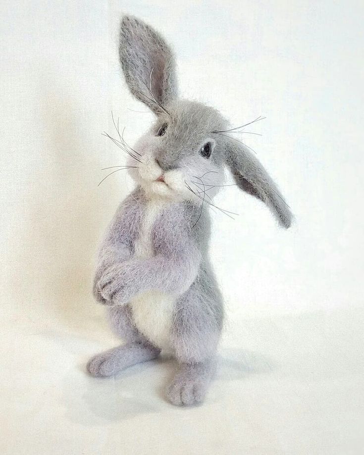 a stuffed rabbit sitting on its hind legs