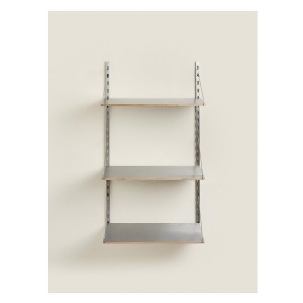 three metal shelving shelves on the wall