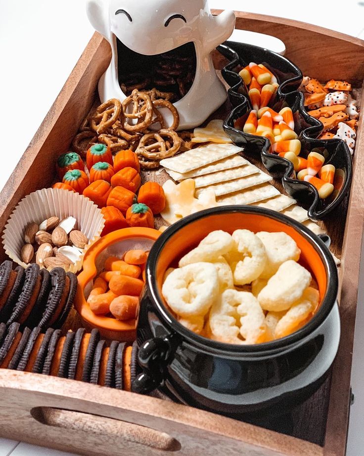 a wooden tray filled with lots of food