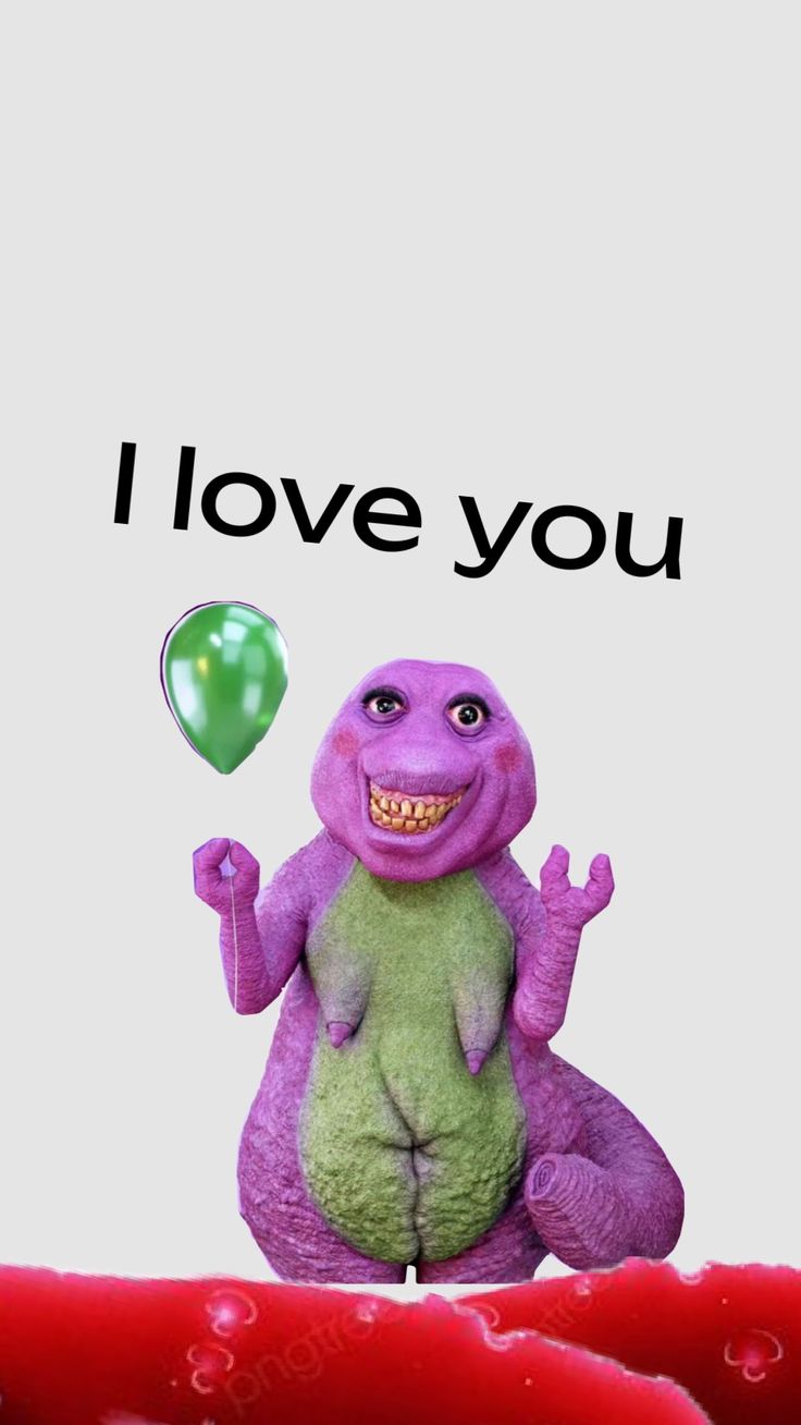 a purple and green stuffed animal sitting in front of a white background with the words i love you on it