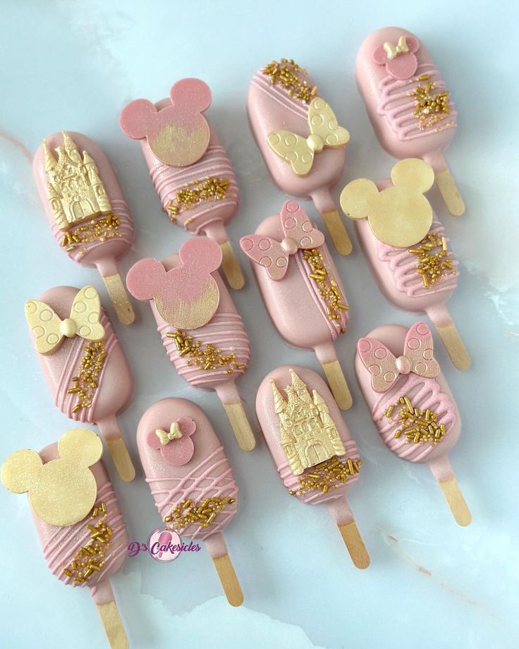 pink and gold mickey mouse cake pops