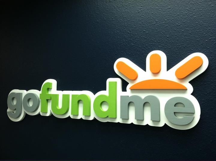 the logo for go fund me is shown in green and orange letters on a black background