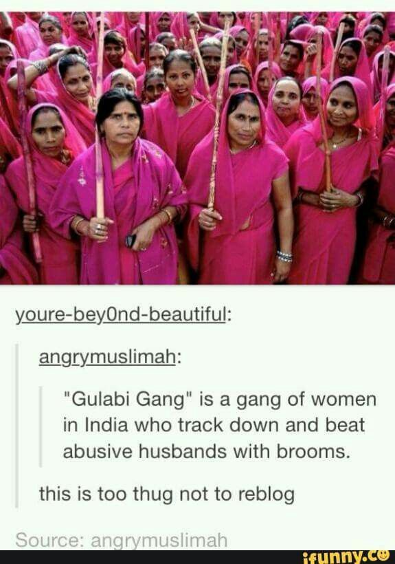 some women in pink are holding sticks and posing for a photo with the caption