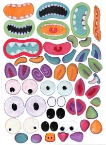 an art project with different colored shapes and sizes, including the eyes and mouth parts