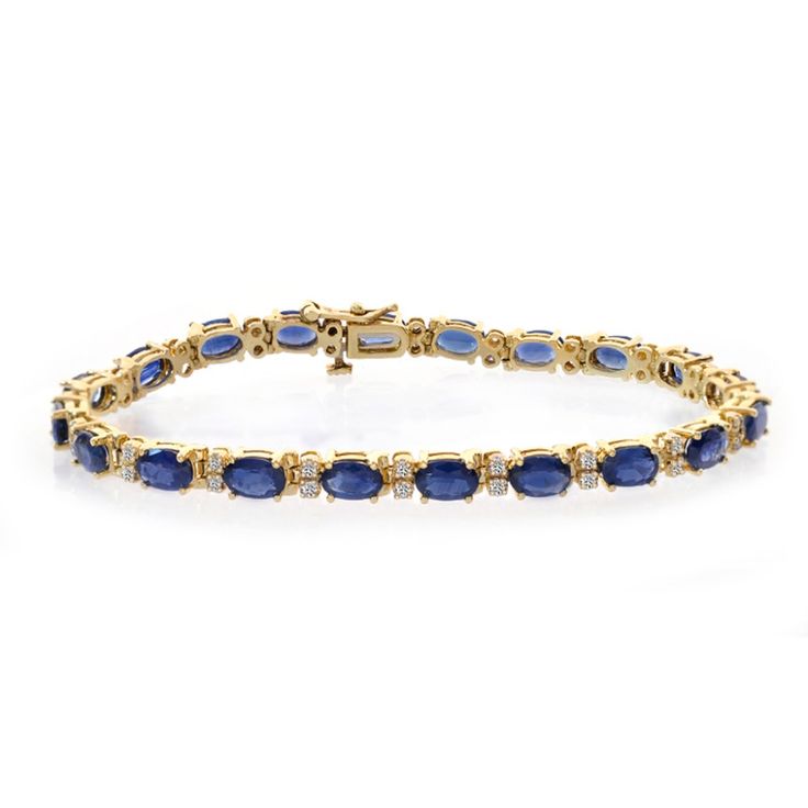 Enviable Style. This Stunning Tennis Bracelet Features Oval-Cut Sapphires (11.00 Ct. T.W.) With Color Aaa And Round-Cut Diamonds (0.40 Ct. T.W.) With I Color, I1 Clarity Set In 14k Yellow Gold. Features A Tongue Clasp For Secure Wear .The Size Of Bracelet Is 7" Inches. Sku: Wcb2013 Classic 14k Gold Gemstone Tennis Bracelet, Classic 14k Gold Tennis Bracelet With Gemstones, 14k Gold Tennis Bracelet With Gemstones For Formal Occasions, Yellow Gold Sapphire Tennis Bracelet For Formal Occasions, Yellow Gold Sapphire Tennis Bracelet For Formal, Formal Sapphire Tennis Bracelet In Yellow Gold, Elegant Yellow Gold Sapphire Tennis Bracelet, Classic Sapphire Diamond Bracelet, Luxury Blue Gold Bracelet For Formal Occasions