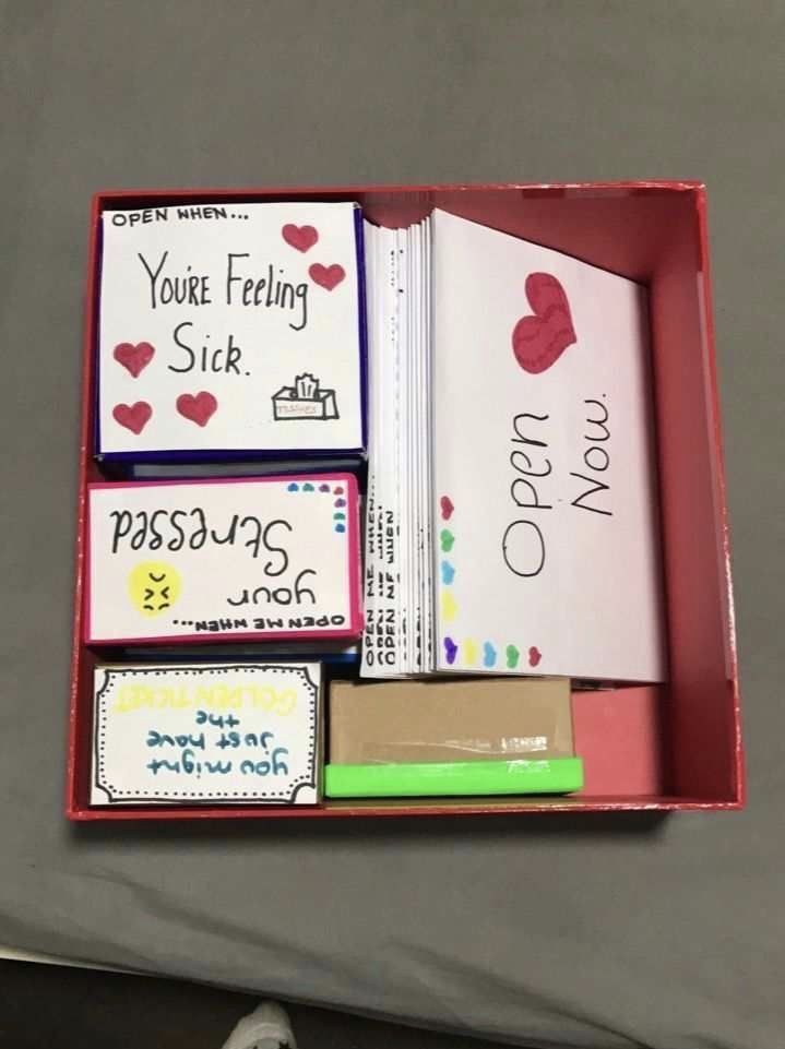 a red box filled with lots of different types of cards and writing on it's sides