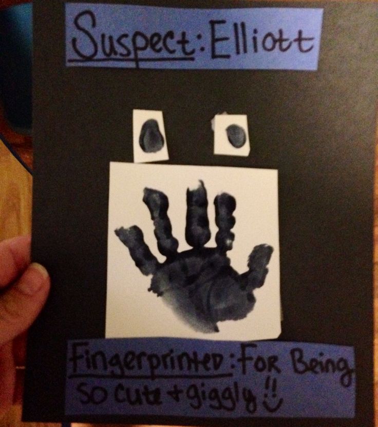 someone is holding up a handprinted poster with the words, suspect ellott