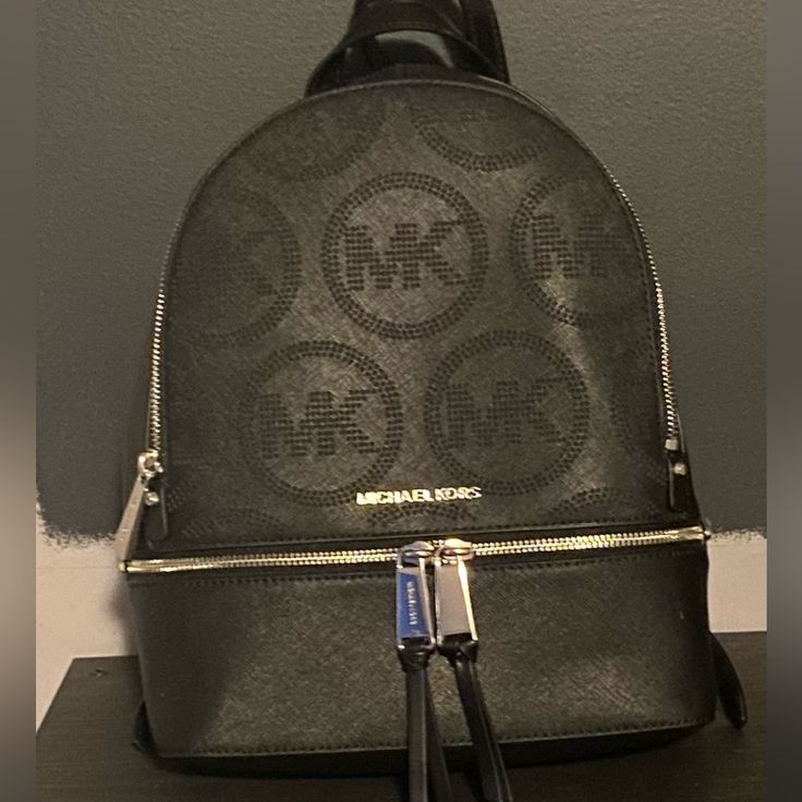 Michael Kors Black Backpack With Adjustable Straps Michael Kors Black Bag With Zipper Closure, Michael Kors Black Travel Backpack, Michael Kors Black Backpack For Travel, Michael Kors Black Standard Backpack, Michael Kors Black Backpack For Everyday, Michael Kors Black Everyday Backpack, Everyday Michael Kors Black Backpack, Michael Kors Backpack, Bags Michael Kors