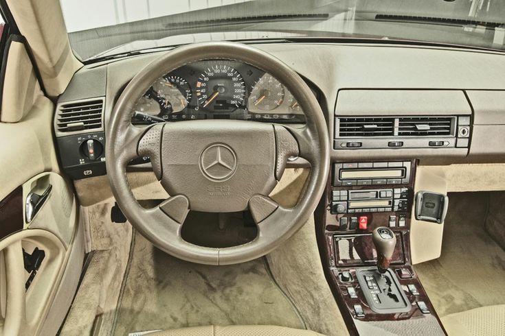 the interior of a car with dashboard and steering wheel