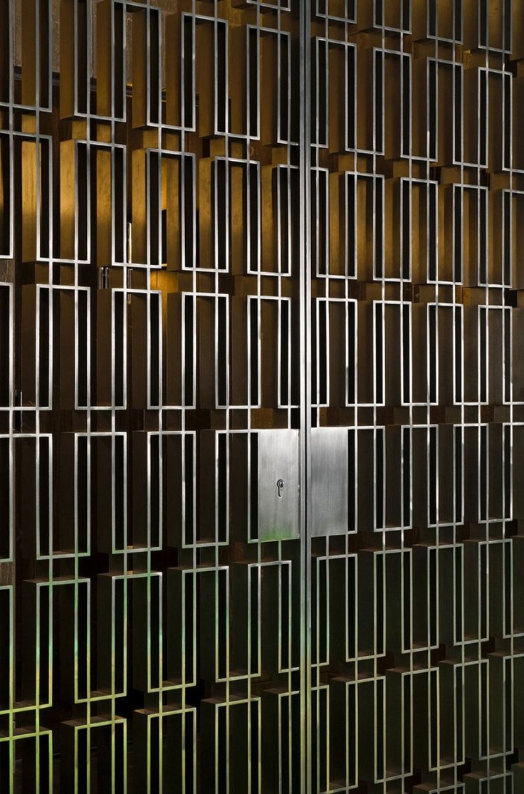 a wall made up of metal squares and bars