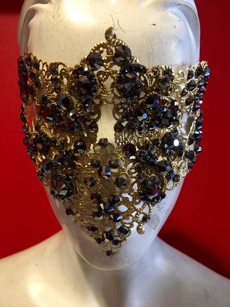 Can't go wrong with this mask! Great conversation piece at any event. Antique gold with black and hematite crystals with a comfortable elastic strap. Multi use and unisex. Wear to cover full face, half face or as a headband. Adjustable Full Face Mask For Masquerade, Gold Adjustable Masquerade Mask, Adjustable Gold Headpiece For Masquerade, Gold Adjustable Masks For Masquerade, Adjustable Gold Mask For Masquerade, Adjustable Gold Masks For Masquerade, Gold Eye Mask For Evening, Gold Full Face Mask For Party, Gold Full Face Party Mask