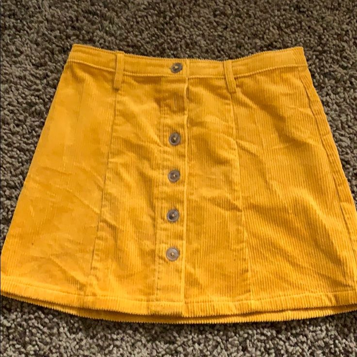 Marigold Colored Skirt With Tag Attached Trendy Yellow Mini Skirt For Fall, Casual Gold Skirt For Spring, Yellow Cotton Skort With Lined Skirt, Yellow Mini Skirt For Fall, Casual Gold Skirt, Casual Mustard Skirt, Yellow Cotton Skort, Orange Corduroy Skirt, Yellow Mini Length Skirt