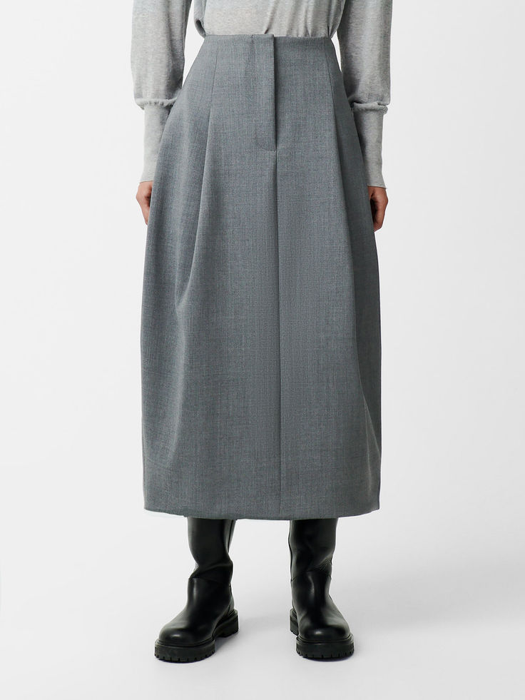 The Carson skirt is cut from a compact poly-viscose fabric that feels spongy yet dense to the touch and helps lend a sculptural bell-like shape to the silhouette. It has deep inverted pleats that are cleverly folded to create extra volume and which also draw the eye down to a thick folded midi hem that stops at the calf. Viscose Skirt, Fleece Skirt, Sculptural Fashion, Studio Nicholson, Viscose Fabric, Gray Skirt, The Eye, Welt Pocket, Womens Skirt