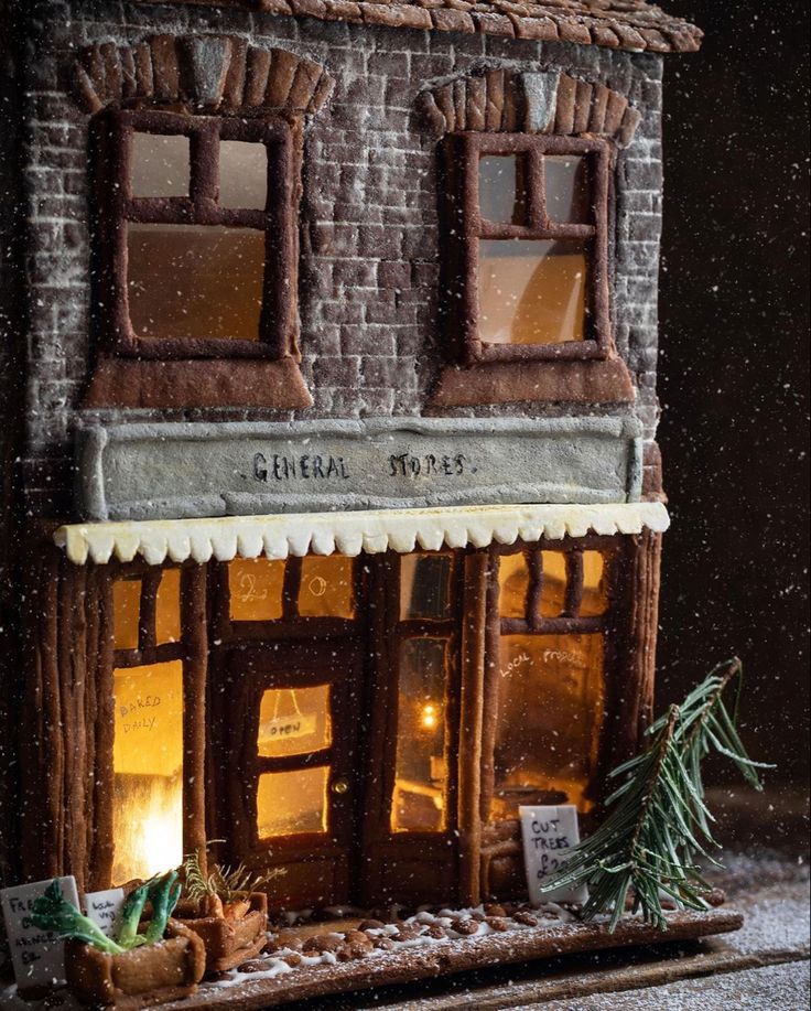 a small building that is made to look like it has snow falling on the ground