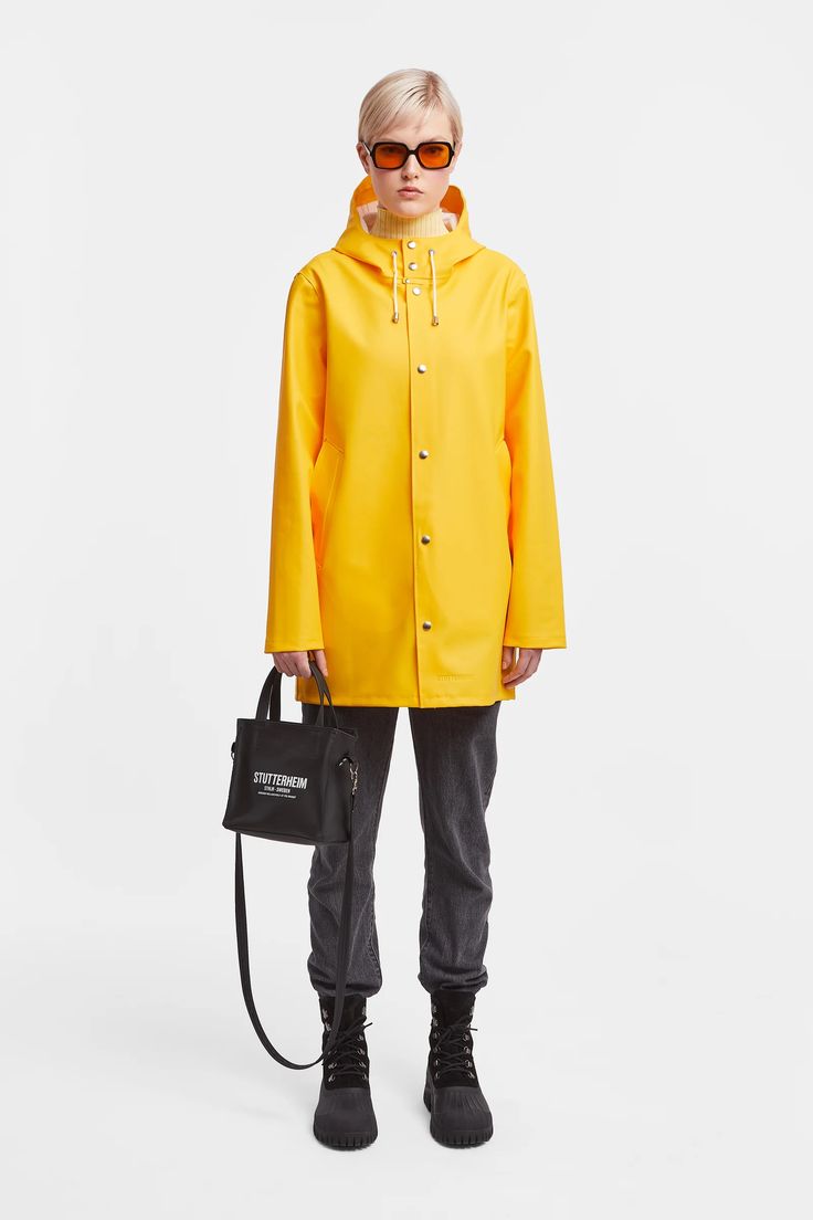 Stockholm Women Raincoat Yellow | STUTTERHEIM US Yellow Parka, Waterproof Rain Jacket, Raincoats For Women, Baby Cold, Waterproof Fabric, Dark Denim, Welt Pocket, Women Collection, Wardrobe Essentials