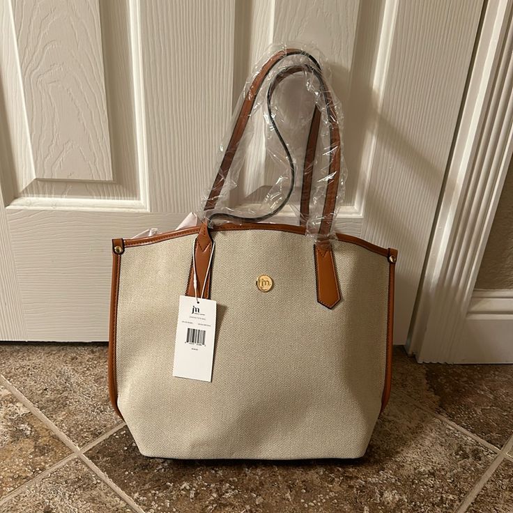 Super Cute Bag! Has Been Sitting In My Closet. No Flaws. Brand New With Tags Price Firm Light Brown Casual Shoulder Bag For Errands, Casual Light Brown Shoulder Bag For Errands, Casual Light Brown Bag For Errands, Casual Tan Bag With Leather Trim, Elegant Brown Canvas Bag For Errands, Beige Canvas Bag With Leather Trim For Errands, Beige Bags With Leather Trim For Errands, Casual Beige Shoulder Bag With Leather Trim, Neutral Casual Shoulder Bag For Errands