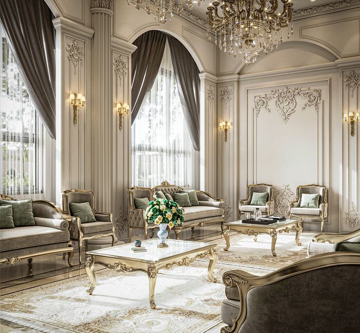 an elegant living room with chandelier and couches in the middle of it